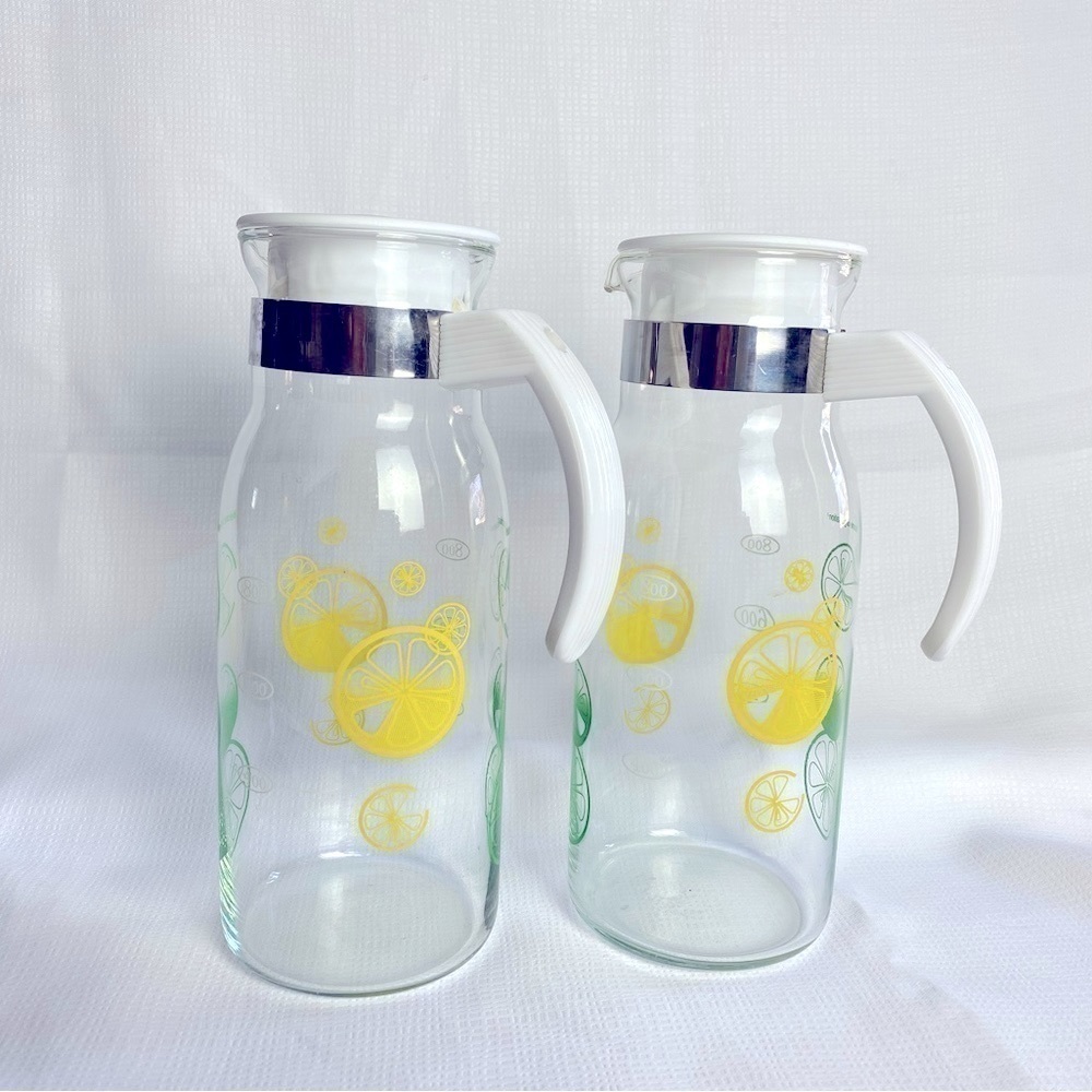 Set of Two Vintage Glass Carafe Lemon Lime Juice Pitchers with Lids